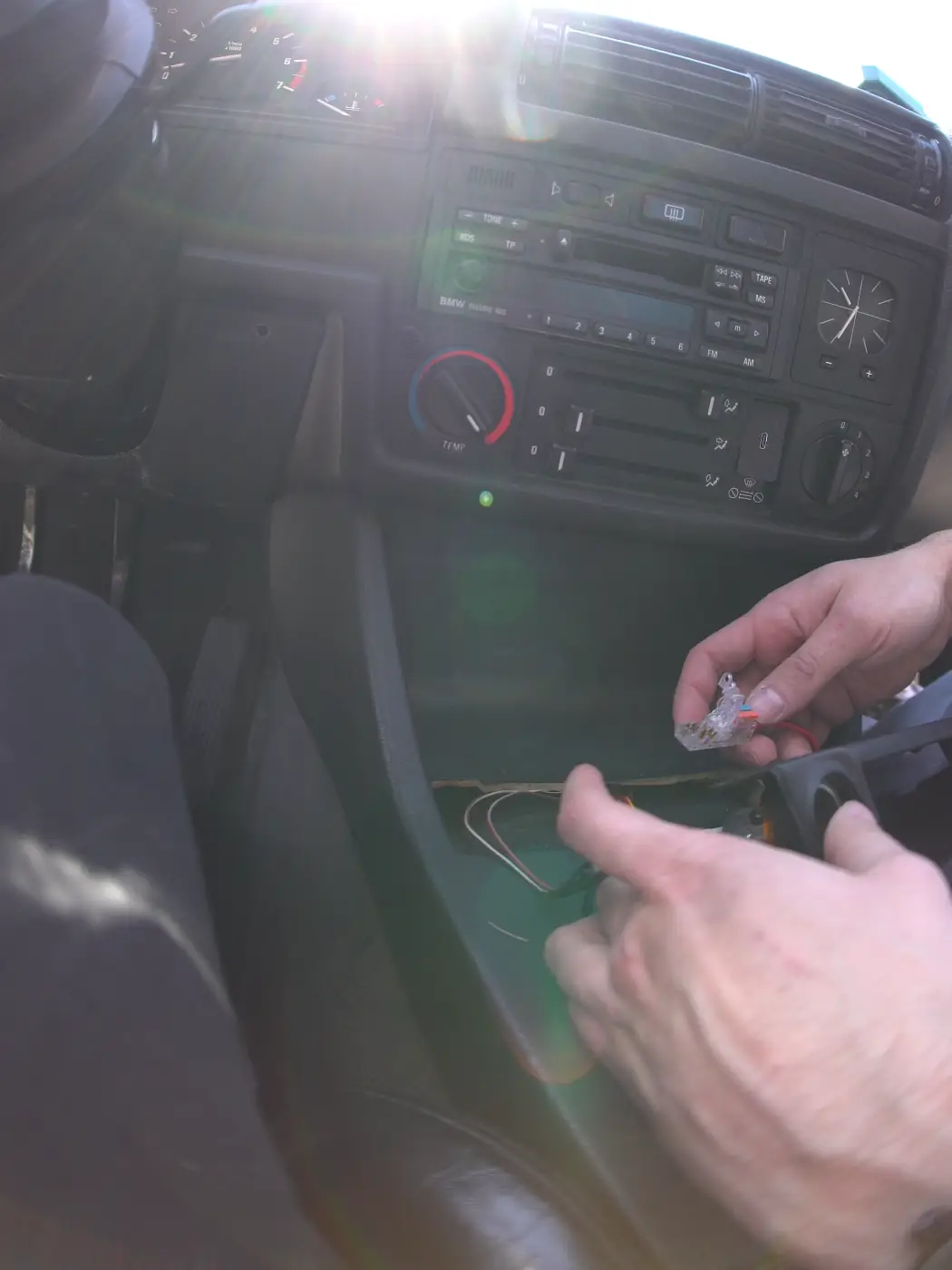5 insert usb charger module into the slot and run wires from behind the center panel to hide them